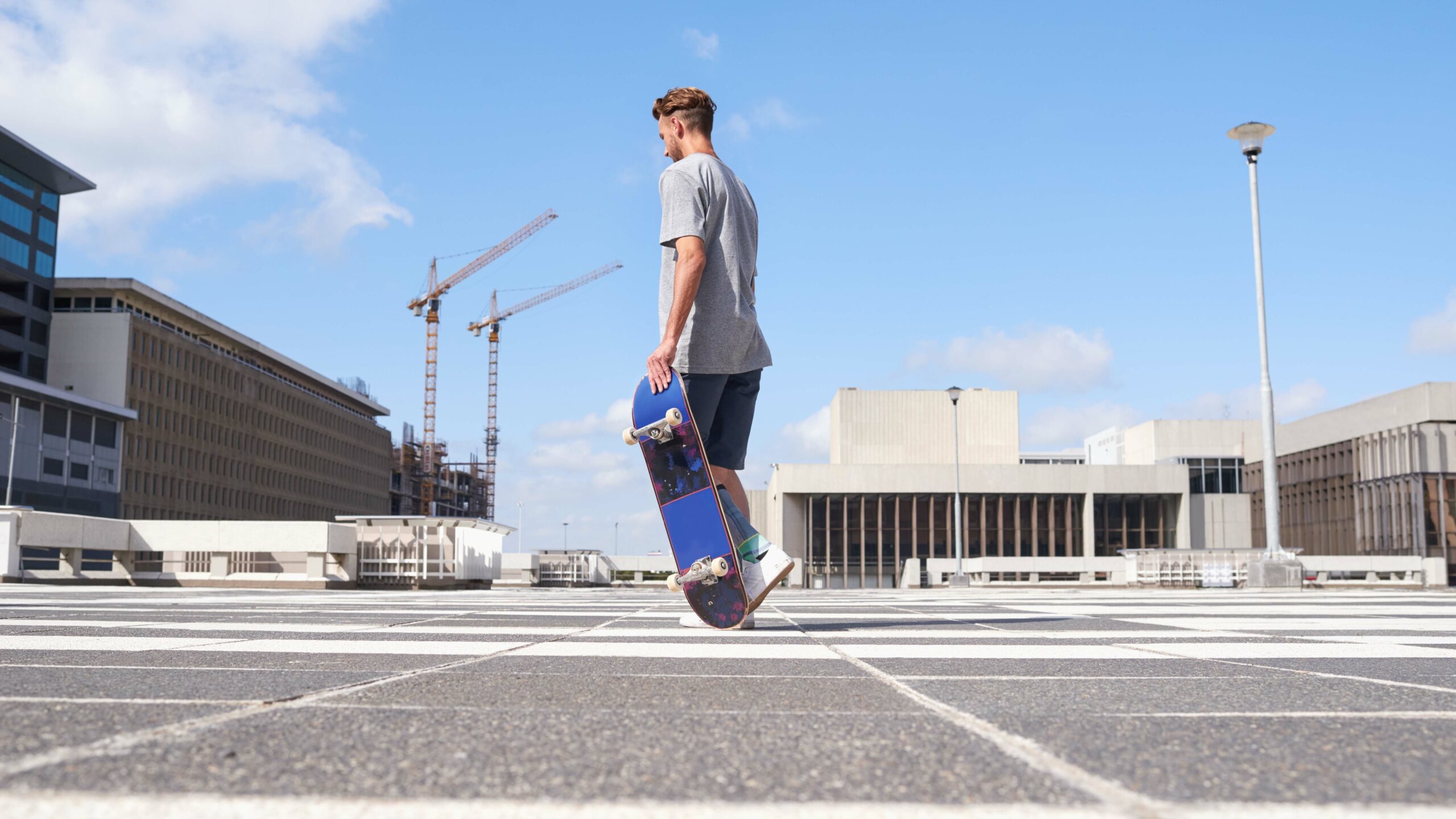 Kaufman & Stigger, PLLC | Kentucky Skateboard Accident Lawyer - Man,,Skateboard,And,Walking,In,Urban,City,,Rooftop,And,Guy