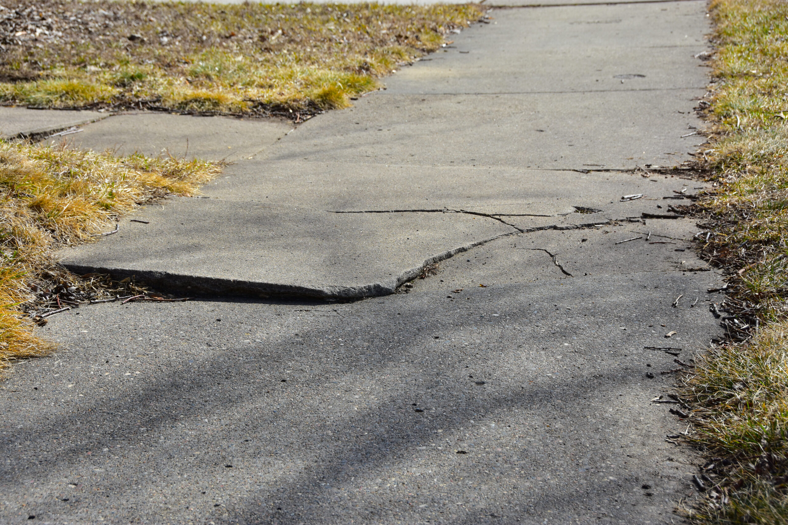 Kaufman & Stigger, PLLC | Trip and Fall Accidents Caused by Potholes in Kentucky - Cracked,And,Broken,Section,Of,Sidewalk,In,City.