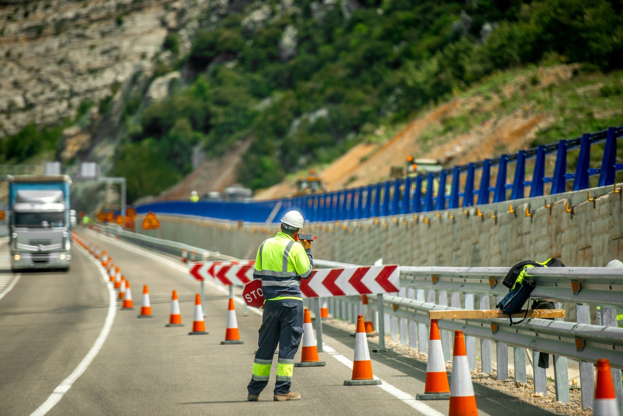 Kaufman & Stigger, PLLC | Louisville Road Construction Accident Lawyer - Road,Undergoing,Repairs,And,Man,With,Stop,Sign